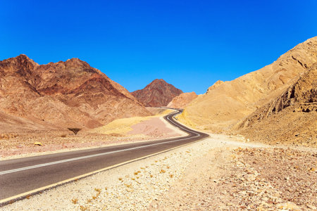 Scenic winding road through the desert. Israel. The highway connects Eilat city to the center of the country. Eilat is major international year-round resort.の写真素材