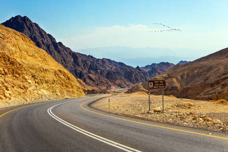 The road to Eilat - a large international year-round resort. The highway connects Eilat city to the center of the country. The highway runs through the Eilat Mountains.の写真素材