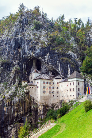 Old medieval castle in the park. Magical places in Slovenia. Postojna Cave. Limestone plateau. The famous and most visited place in the country by tourists.のeditorial素材