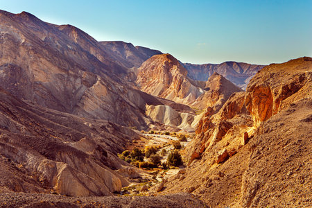Magnificent sandstone multi-colored rocks. The Timna Valley in the south of the Arava Desert, near the resort of Eilat. Israel. Hot November day.の写真素材