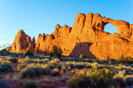 Picturesque red-brown sandstone cliffs form a unique landscape. Skyline Arch. The unique beauty of...