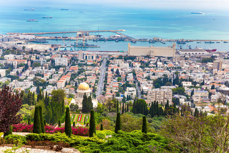 HAIFA, ISRAEL - MAY 6, 2017: Bahai World Center. Pilgrimage center and popular tourist destination. View from Mount Carmel to the seaport of Haifa. Sunny day by Mediterranean Sea.のeditorial素材