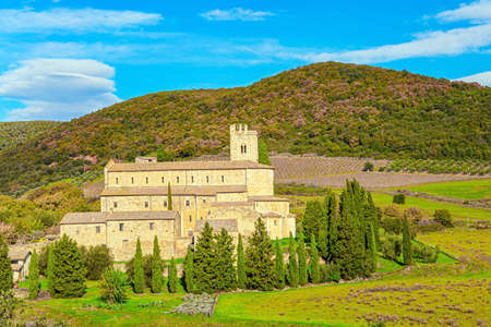 Charming abbey among fields. Abbey of Sant Antimo. Sunny day at the beginning of winter. The magical beauty of the province of Tuscany. Magnificent Italy.の写真素材