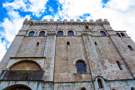 The antique city of Gubbio with a rich history and grandiose architecture. The city is located in the Umbrian mountains. Piazza Grande is the city center. Rainy day. Italyの写真素材