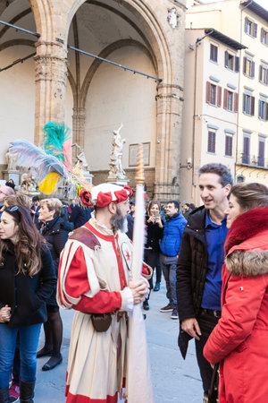 FLORENCE, ITALY - NOVEMBER 30, 2019: Fancy-dress ball in the Signoria square. Carnival participants...