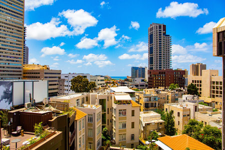 TEL AVIV, ISRAEL - JUNE 2, 2021: Israel, Tel Aviv. The famous building Migdal Shalom, in the past - the tallest building in the Middle East. Summer morning. Photo taken from the balcony of hotel.のeditorial素材