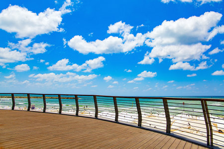 The Tel Aviv. Mediterranean Sea. Wooden embankment "Dek". Sunny day on a beautiful beach.の写真素材