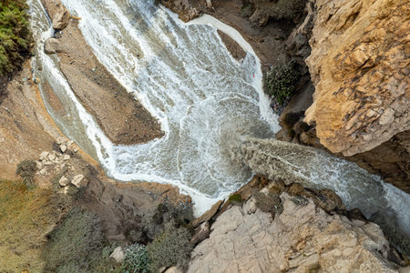 Winter flood on the Kidron stream. Cold rainy winter in Israel. The famous biblical stream Kidron. Ancient mountains around the Dead Sea. The waterfall were photographed by a drone.の写真素材