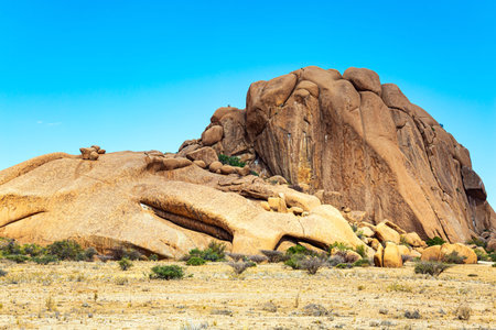 Spitzkoppe is a small picturesque rock massif in Namibia. Magnificent stone red-orange remains of...