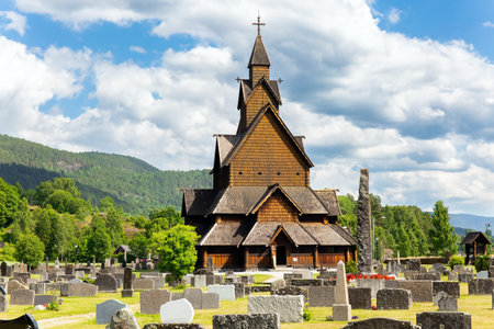 Travel to Norway in summer. The Stave Church in Heddal is the largest surviving frame church. Ancient cemetery in the churchyardの写真素材