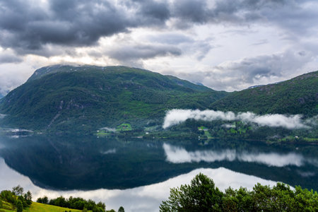 Beginning of the Hardangerfjord. Scenic road in the mountains of Western Norway. Scandinavia. Magical journey in the cold northern country. Summer, Julyの写真素材