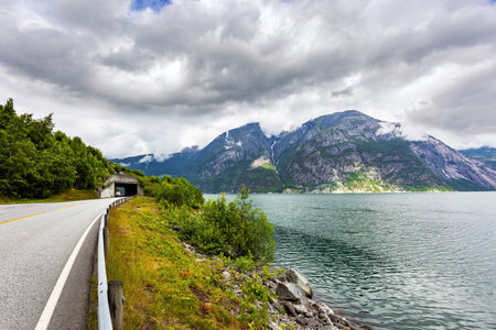 Scenic road in the mountains of Western Norway. Beginning of the Hardangerfjord. Scandinavia. Summer, July. Magical journey in the cold northern country.の写真素材