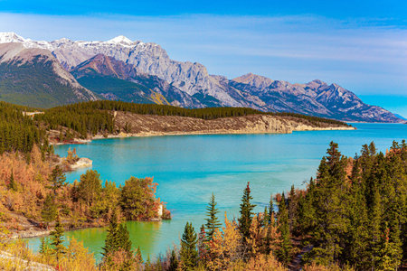 Rocky Mountains of Canada. Canadian autumn at artificial Abraham Lake. Picturesque autumn landscape. Gorgeous turquoise color of glacial lake water.の写真素材