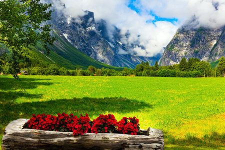 The famous and majestic Troll Wall "Trollsvegen". Summer trip to Norway. Warm cloudy day. Northern Europe in July.の写真素材