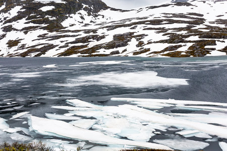 Gorgeous Lake Djupvatnet. Summer trip to Norway. Cold July in Northern Europe. Frozen lakes and waterfallsの写真素材
