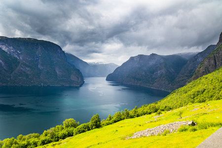 Majestic huge and picturesque Aurlandsfjord. View from the Stegastein lookout. Cold July in Northern Europe. Summer trip to Norway.の写真素材