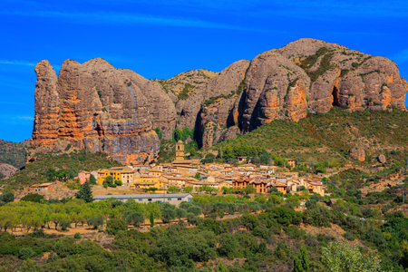 Aguero village at the foot of the magnificent Mallos cliffs. Romantic trip to northern Spain. The magical nature of Spain. Province of Huesca, Aragon.の写真素材