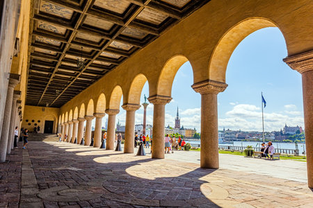 The magnificent colonnade of the city hall of Stockholm. Hot summer day. Picturesque Stockholm is the capital of Sweden.の写真素材