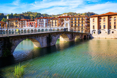 Beautiful bridge was built across the river Oria. Tholosa is small old town with interesting and unusual architecture. Basque country.の写真素材