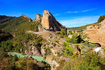 The Gallego River in province of Las Penias de Riglos. Stormy waterfall among steep cliffs. Indian summer in northern Spain. Wonderful day. Beautiful landscape.の写真素材