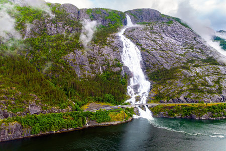 Langfossen is a magnificent cascading waterfal on the Vaule River. Passes through the highway. Western Norway. Filmed with a droneの写真素材