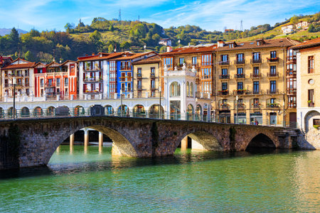 Beautiful bridge was built across the river Oria. Tholosa is a small old town with interesting architecture. Basque country.の写真素材