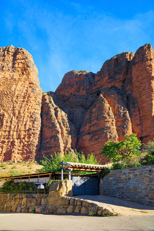 The Mallets of Riglos. Parking at foot of the rocks. Aragon. Part of the foothills of the Pyrenees. Hot sunny afternoon. Romantic trip to Spain.の写真素材