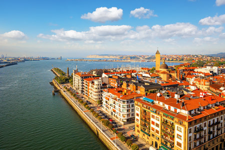 The famous unique outboard ferry. Flying ferry across the Nervion River. Photo taken from aerial view. European exotic. Portugalete, the district of Bilbao. Basque country.の写真素材