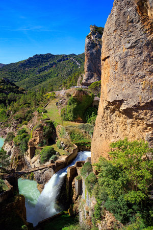 Stormy waterfall among steep cliffs. The Gallego River in province of Las Penias de Riglos. Indian summer in northern Spain. Wonderful day. Beautiful landscape.の写真素材