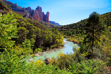 The magnificent Mallets of Riglos. The river Gallego flows through the gorge. Beautiful rocks - part of the foothills of the Pyrenees. Aragon. Romantic trip to Spain.の写真素材