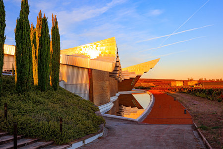 Laguardia. Winery - bodega Bodegas Ysios. Enchanting facade. Bright flaming colors of the sunset. Journey to the warm Spanish autumnの写真素材