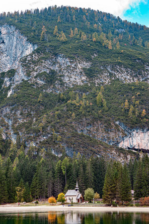 Great walk around a picturesque lake Lago di Braies. The clear blue-green water of the lake reflects the mountains and dense coniferous forest. South Tyrol, Dolomites. Travel to Europeの写真素材