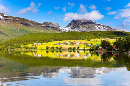 The lovely clean and calm lake Eidsvatnet. Warm sunny day in July. Northern Europe. Summer trip to Norway.の写真素材