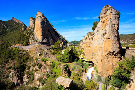 The La Penia Reservoir collects the waters of the Gallego River. Wonderful autumn day in Northern Spain. Stormy waterfall among steep cliffs.の写真素材