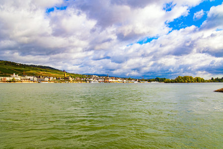 Smooth flow of the great river Rhine. Romantic castles on the banks of the Rhine. The hills are home to the famousl vineyards.の写真素材