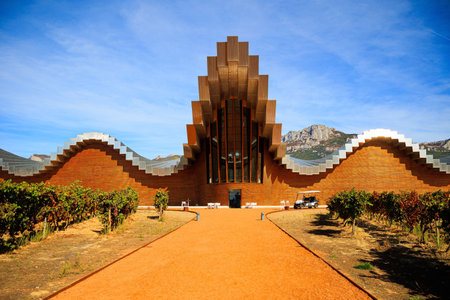 Laguardia. The sunset. The magnificent architecture of Bodegas Ysios blends in beautifully with the surrounding landscape and rows of vineyards. Impressive landscape. Spanish autumnのeditorial素材