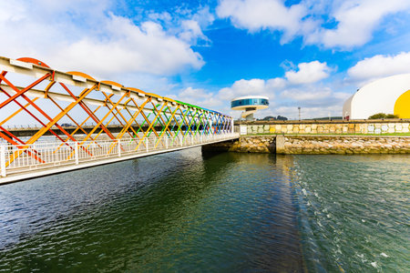 Magnificent light bridge over the river Aviles. International cultural center of the famous architect Oscar Niemeyer. The picturesque town of Avilas in Asturias. North of Spain.のeditorial素材