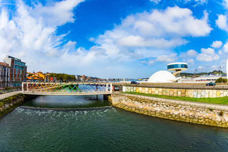 Cultural international center of the famous architect Oscar Niemeyer. Magnificent light bridge over the river Aviles. The picturesque town of Avilas in Asturias. North of Spain.のeditorial素材