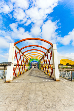 Magnificent light bridge over the river Aviles. The picturesque town of Avilas in Asturias. North of Spain. International cultural center of the famous architect Oscar Niemeyer.のeditorial素材