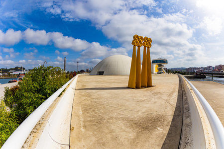 The complex consists of several futuristic buildings of white color and various shapes. Oscar Niemeyer International Cultural Center. Picturesque town in Asturias. Spainのeditorial素材