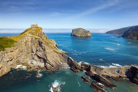 The most extraordinary coast of Spain. The island Gastelugache connected to the mainland by a bridge and winding staircase. Photo taken from a drone. Basque Country. Magical landscape.の写真素材