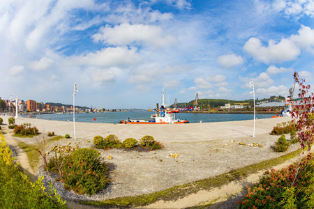 Port at the mouth of the Aviles River. International cultural center of the famous architect Oscar Niemeyer. The picturesque town of Avilas in Asturias. North of Spain.の写真素材