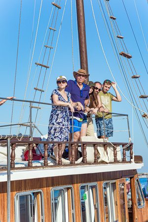 Happy family. Walk on a sailing yacht. Family holidays on the Greek island of Cyprus.の写真素材