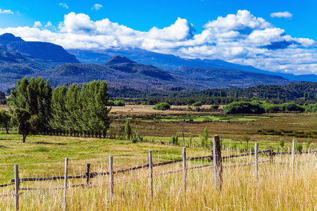 Charming rural pastoral. Fields and mountains surround the famous highway 40. Travel to South America. The road passes through picturesque landscapes. Argentina.の写真素材
