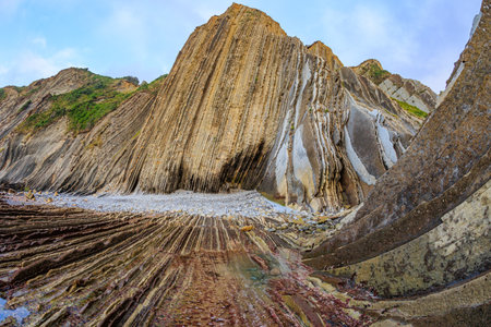 Flysch - unique landscape of underwater rocks exposed at low tide. Coast of the Bay of Biscay, Atlantic. Incredibly bizarre coastal cliffs. Playa Zumaya. The Basque Country - Itsurun.の写真素材