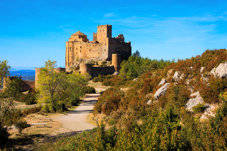 Spanish fortress - Loarre castle. The Spanish defensive structure was built a thousand years ago. The morning sun. Sunrise. Autumn trip to Spain, Aragon.のeditorial素材