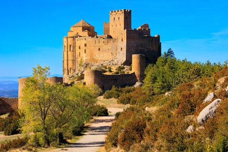 Spanish fortress - Loarre castle. Sunrise. The Spanish defensive structure was built a thousand years ago. The morning sun. Autumn trip to Spain, Aragon.のeditorial素材