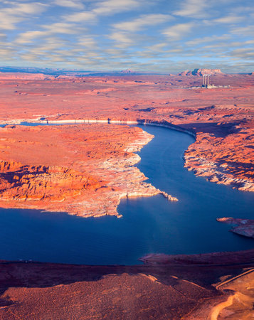Lake Powell is a reservoir on the Colorado River. USA. The blue water of the lake contrast beautifully with the red-brown massifs of the surrounding rocks. The photos were taken from the plane.の写真素材