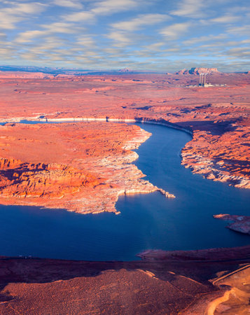 Lake Powell is a reservoir on the Colorado River. USA. The blue water of the lake contrast beautifully with the red-brown massifs of the surrounding rocks. The photos were taken from the plane.の素材 [FY310201815819]