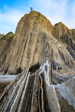 Playa Zumaya Basque country. Flysch - unique landscape of underwater rocks exposed at low tide. The beach Itsurun.の写真素材